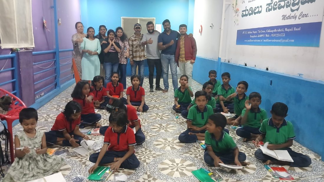 Children with stationery at Madilu Sevashrama